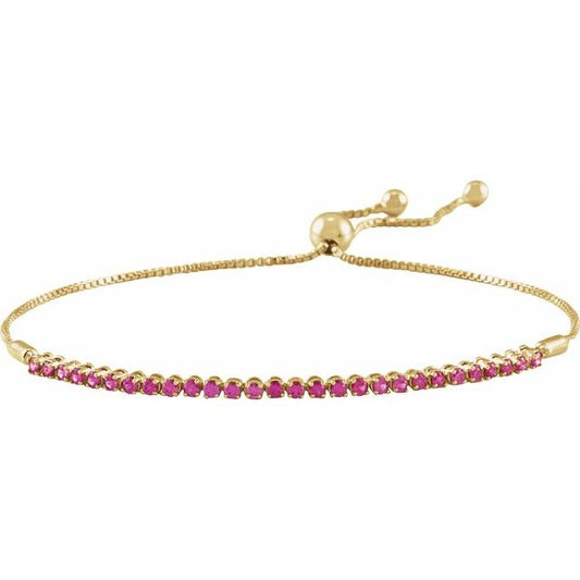 Pulsera de oro amarillo de 14k con rubíes.
